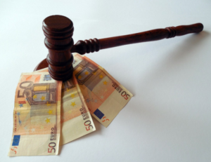 a gavel on top of money